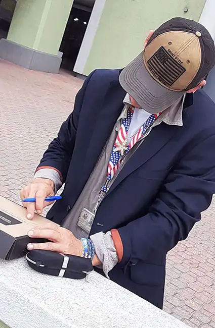 David Haave signing his first copy of the Butterflies and Friendships book for the kids in Port Arthur Texas USA -- David Haave